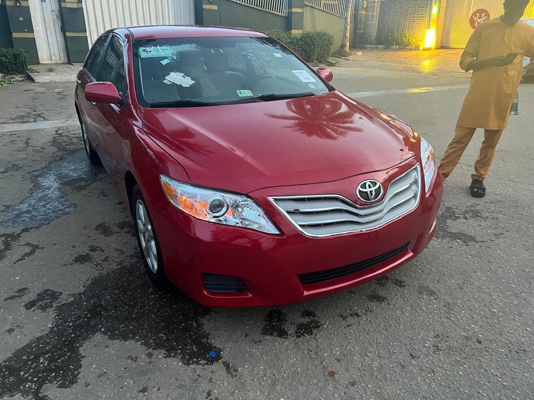 2011 Toyota Camry in red.